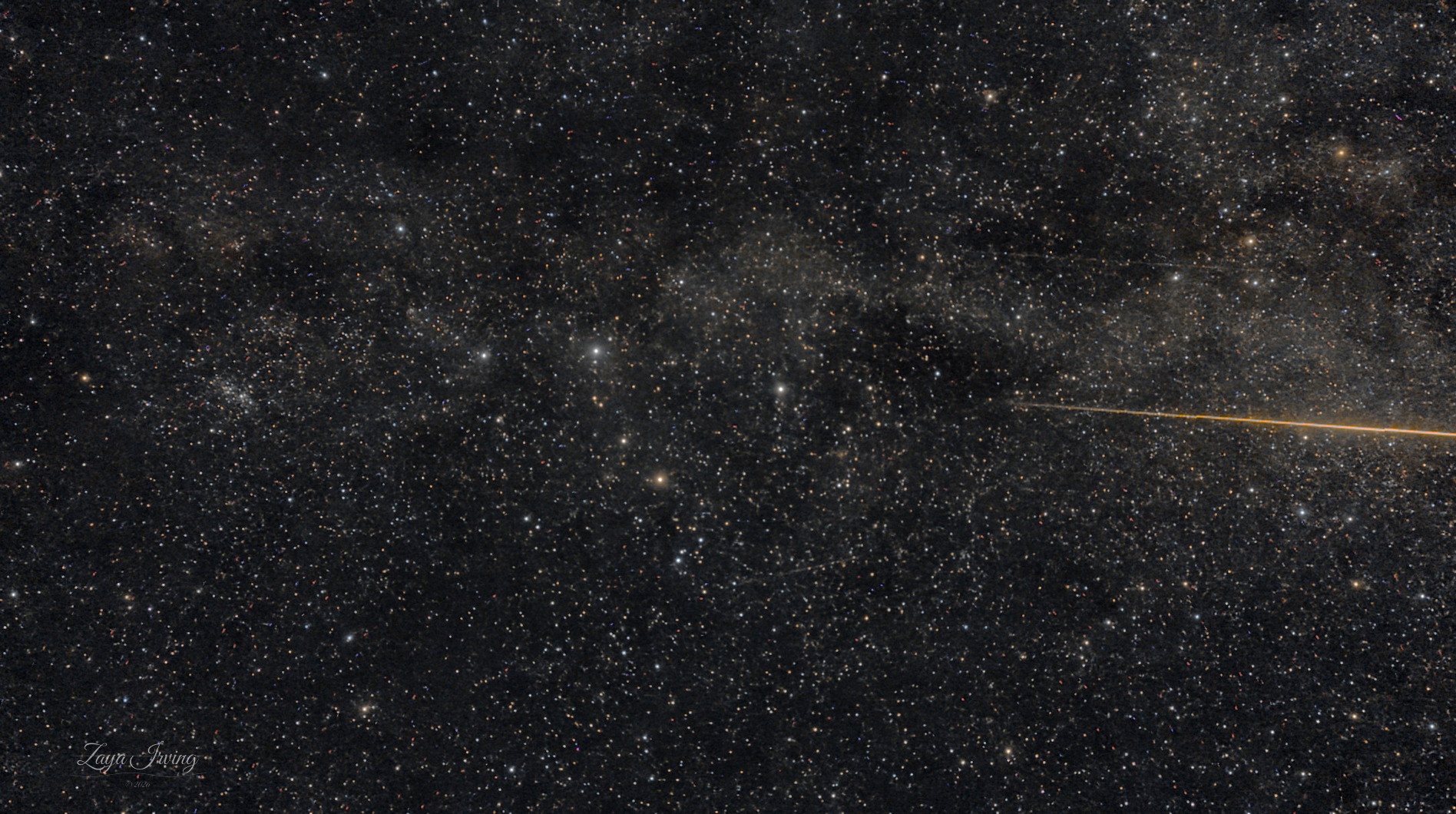 A Perseid meteor near the Double Cluster, wide field